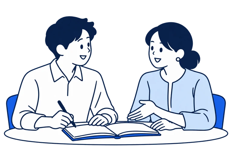 ノートを広げて対話し、現状と課題を整理する二人